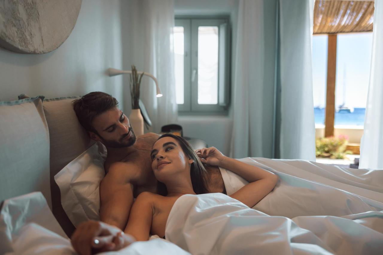 Mykonos Ammos Hotel - Small Luxury Hotels Of The World Ornos  Esterno foto A couple in bed